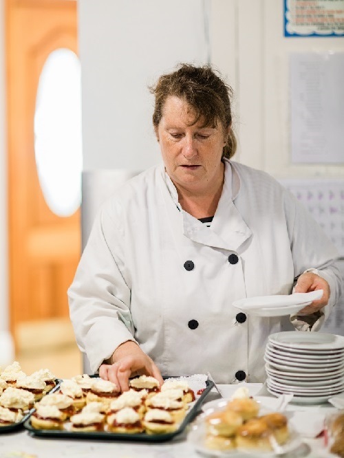 Kitchen staff with cakes